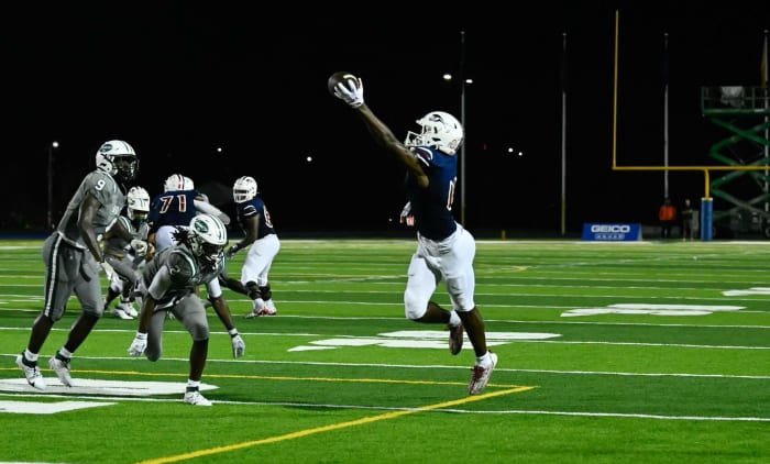 Jeremiah Smith (making a stunning one-handed touchdown grab against Miami Central earlier this year) said a potential flip from Ohio State to Miami would be "tempting" should his teammate and quarterback Cedrick Bailey also make the flip after receiving and offer from the Hurricanes this week. He, Bailey and Joshia Trader, already a Miami commit, have been friends and teammates since they were 11.